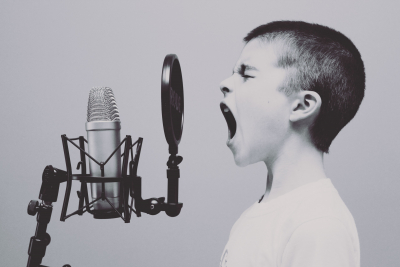 Boy Screaming into Microphone